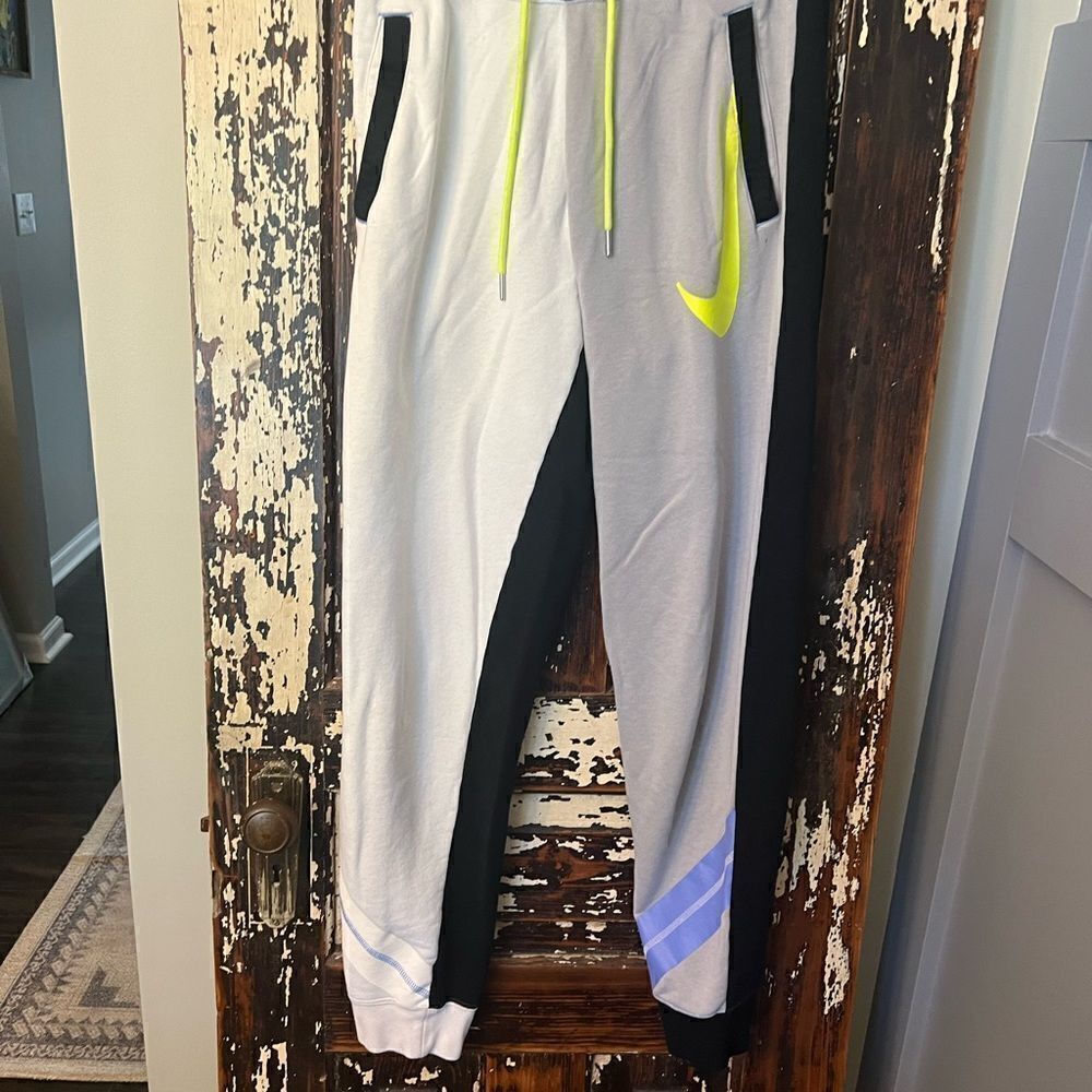 Nike black label Big swoosh multi color women’s comfy sweatpants. Size small.